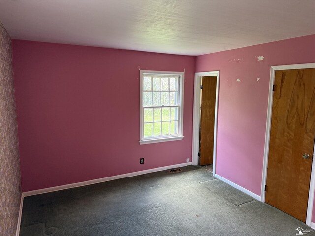 8367 S Douglas Rd, Bedford, MI 48144 - spare room featuring baseboards, carpet flooring, and visible vents