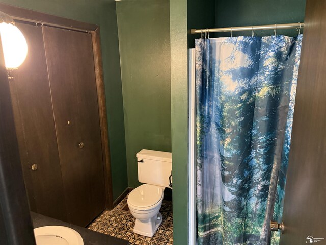 8367 S Douglas Rd, Bedford, MI 48144 - bathroom with toilet, tile patterned floors, and a shower with shower curtain