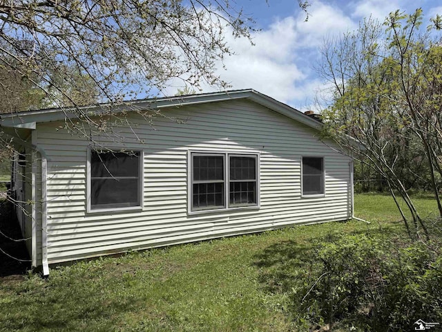 8367 S Douglas Rd, Bedford, MI 48144 - view of property exterior with a yard