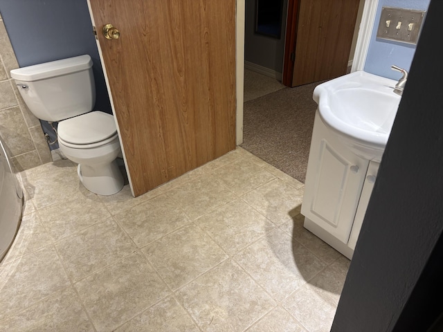 bathroom with toilet and vanity