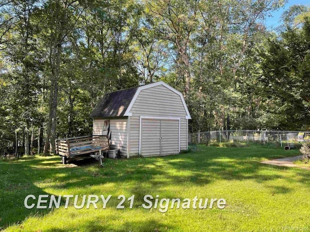 view of shed featuring fence