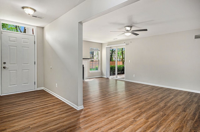 foyer with wood finished floors, ceiling fan, and baseboards