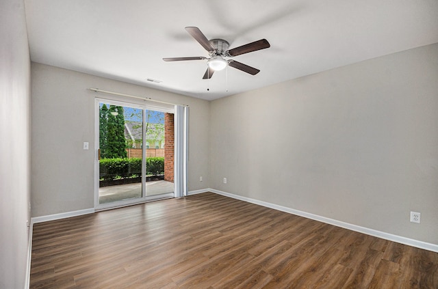 unfurnished room with wood finished floors, baseboards, and ceiling fan