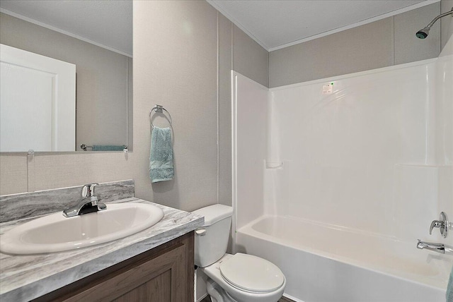 full bathroom featuring toilet, bathing tub / shower combination, vanity, and crown molding