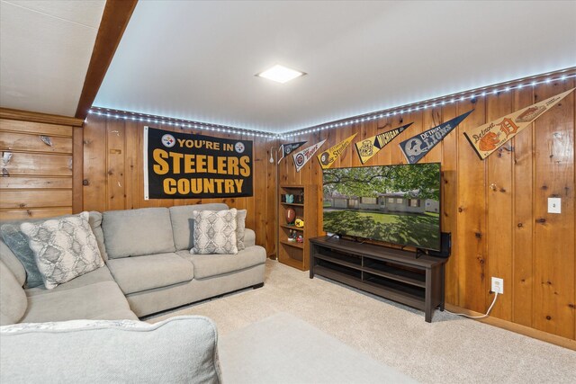 living room featuring carpet flooring and wooden walls