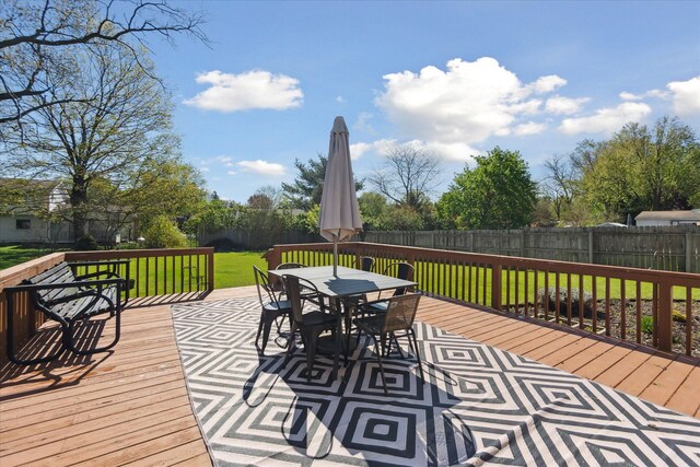 wooden terrace featuring outdoor dining space