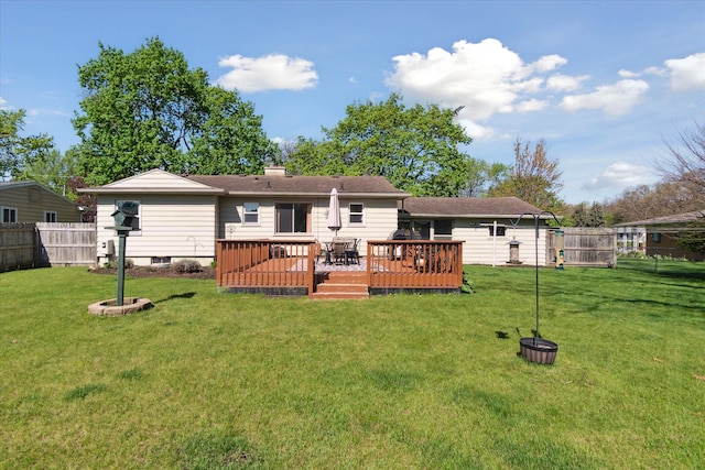 back of property featuring a wooden deck and a chimney