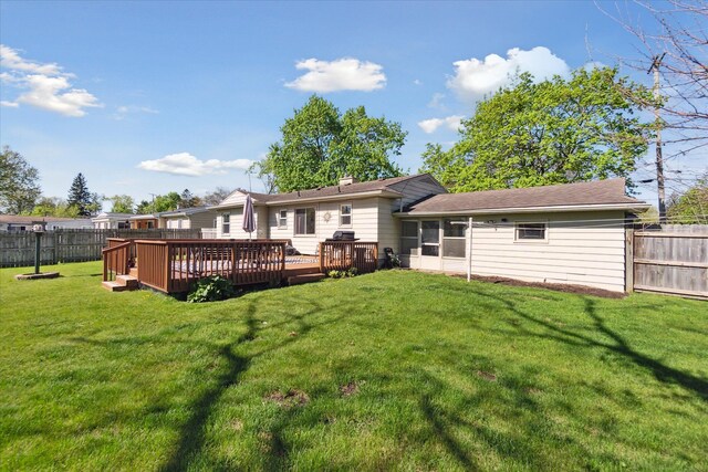 back of house with a deck