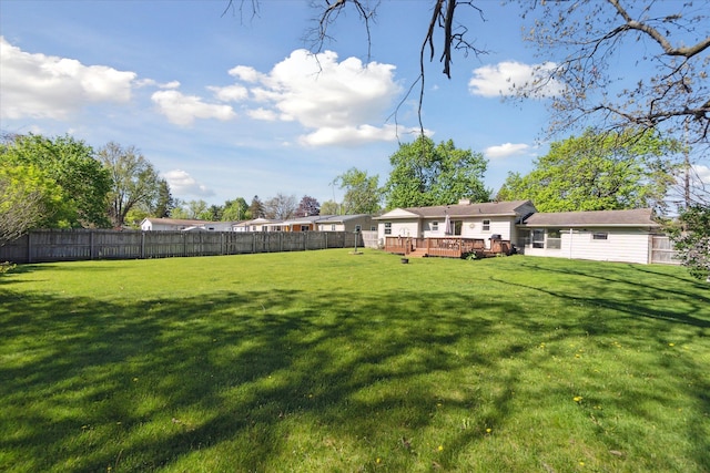 view of yard with a wooden deck