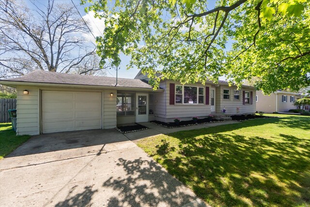 split level home featuring a garage and driveway
