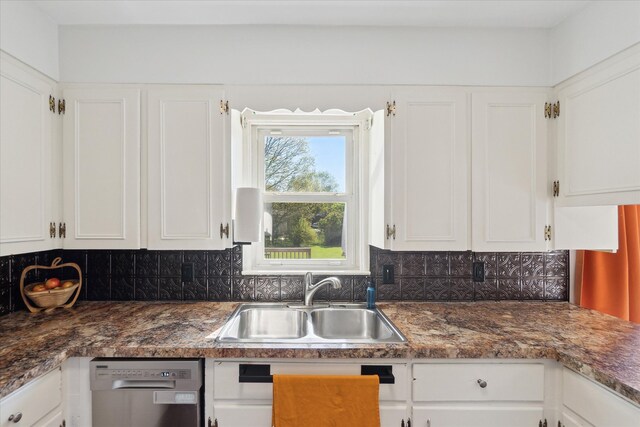 kitchen featuring a sink, dishwasher, and white cabinets