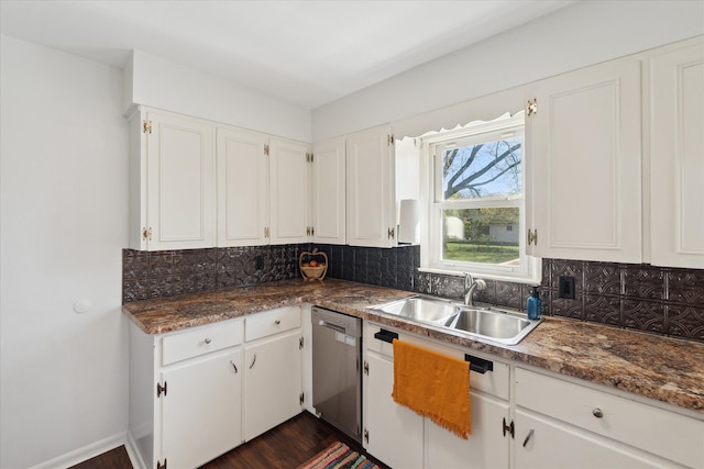 kitchen with a sink, stainless steel dishwasher, decorative backsplash, and white cabinetry