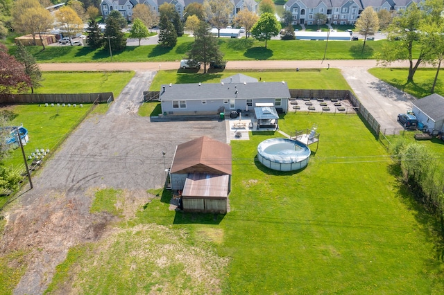 birds eye view of property with a residential view
