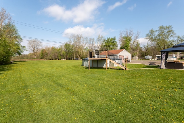 view of yard with a gazebo and stairway