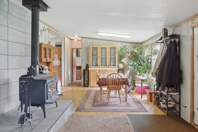 sunroom with a wood stove
