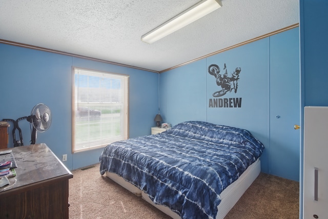 bedroom featuring a textured ceiling and carpet