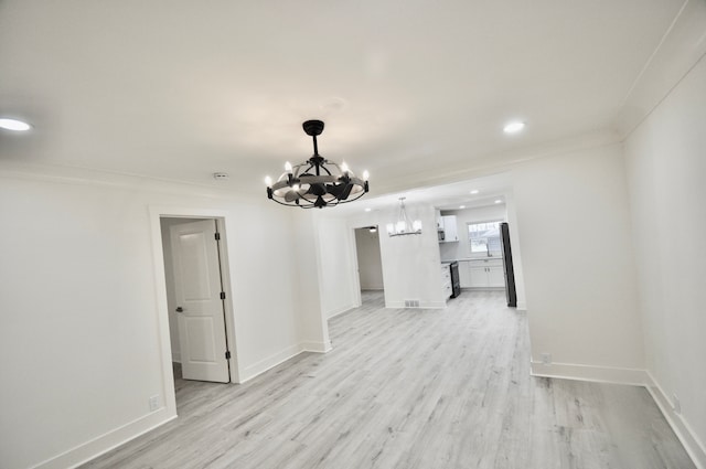 unfurnished dining area with a chandelier, light wood-type flooring, recessed lighting, and baseboards