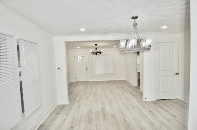 unfurnished dining area with a chandelier, light wood-style floors, baseboards, and recessed lighting