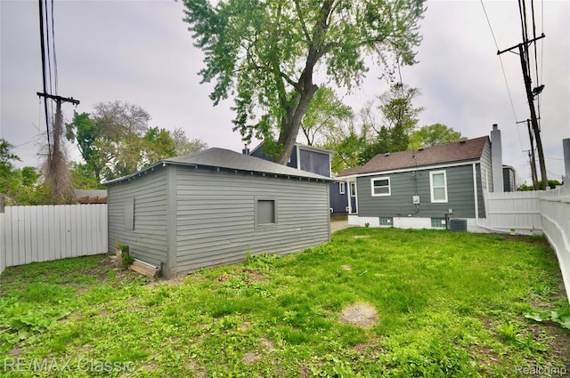 23027 Powell Ave, Hazel Park, MI 48030 - back of property featuring central AC and an outdoor structure