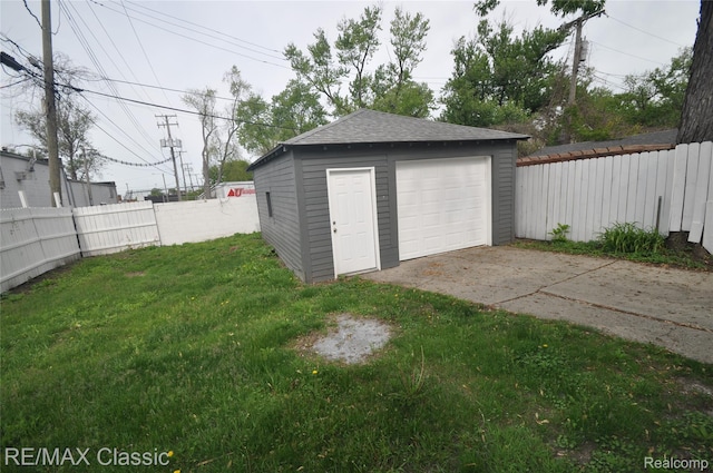 23027 Powell Ave, Hazel Park, MI 48030 - detached garage featuring driveway