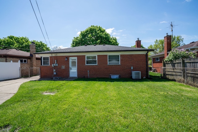 rear view of property with brick siding, central AC unit, and a chimney