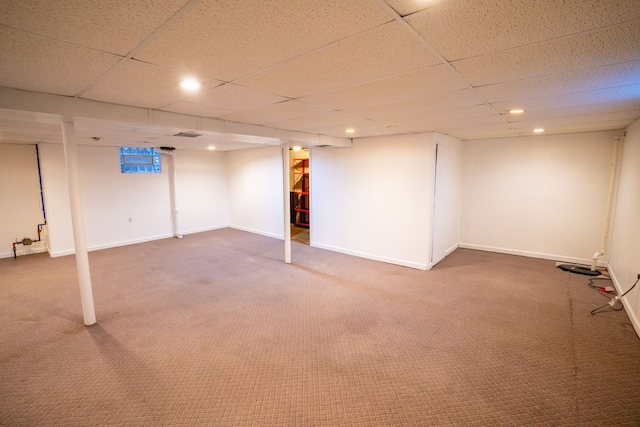 finished basement with carpet floors, recessed lighting, a paneled ceiling, and baseboards