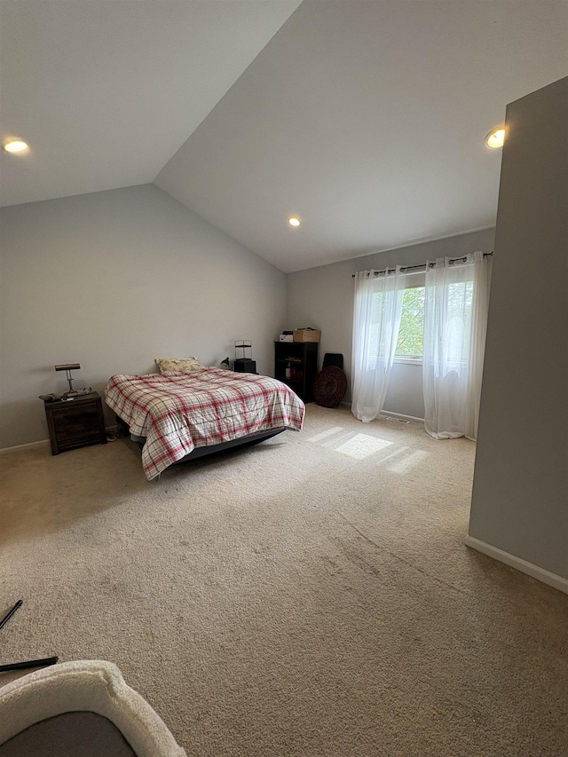 carpeted bedroom featuring lofted ceiling, baseboards, and recessed lighting
