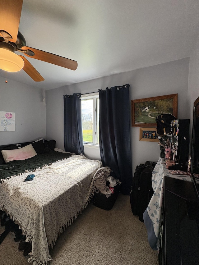 bedroom featuring ceiling fan and carpet floors
