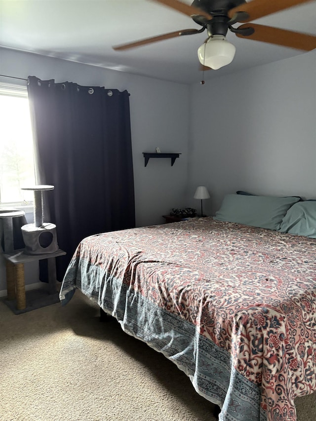 carpeted bedroom featuring a ceiling fan