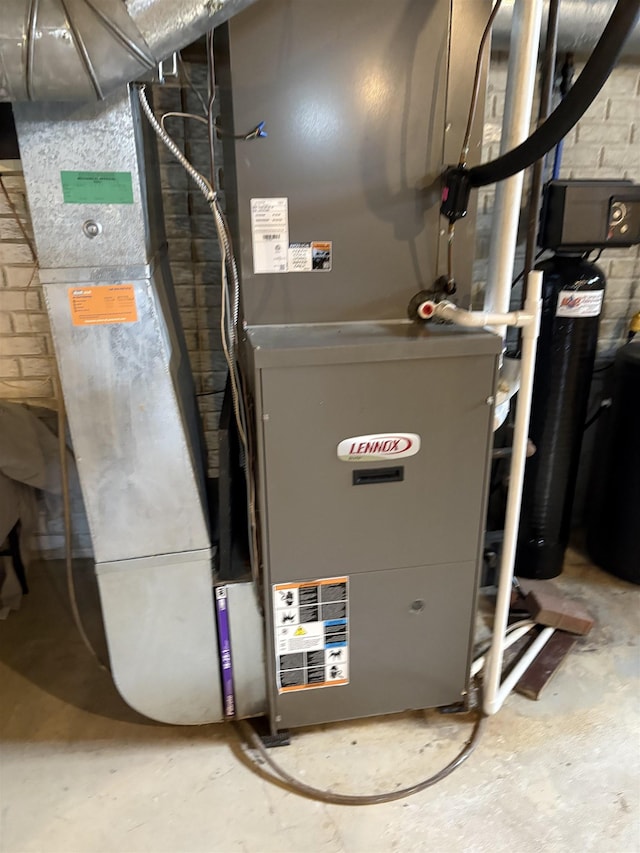utility room featuring heating unit
