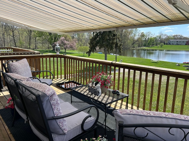 26955 Milford Rd Unit 20, South Lyon, MI 48178 - wooden deck featuring a water view, a yard, and outdoor lounge area