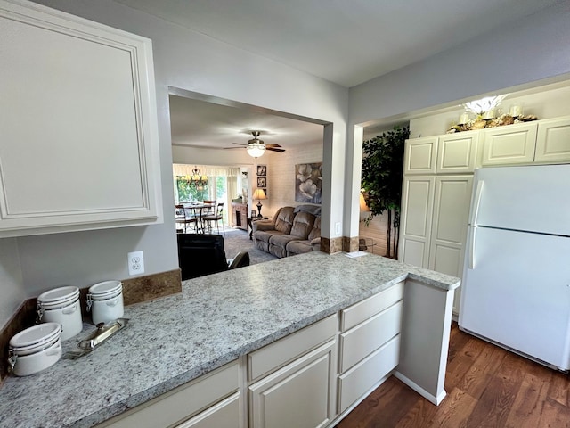 26955 Milford Rd Unit 20, South Lyon, MI 48178 - kitchen featuring freestanding refrigerator, a ceiling fan, light stone counters, white cabinets, and dark wood-style floors