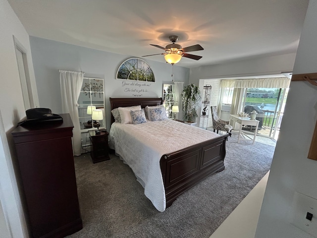 26955 Milford Rd Unit 20, South Lyon, MI 48178 - bedroom featuring access to outside, a ceiling fan, and dark carpet