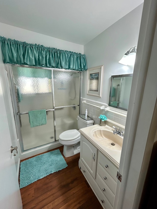 26955 Milford Rd Unit 20, South Lyon, MI 48178 - full bathroom with toilet, tile walls, wood finished floors, vanity, and a stall shower