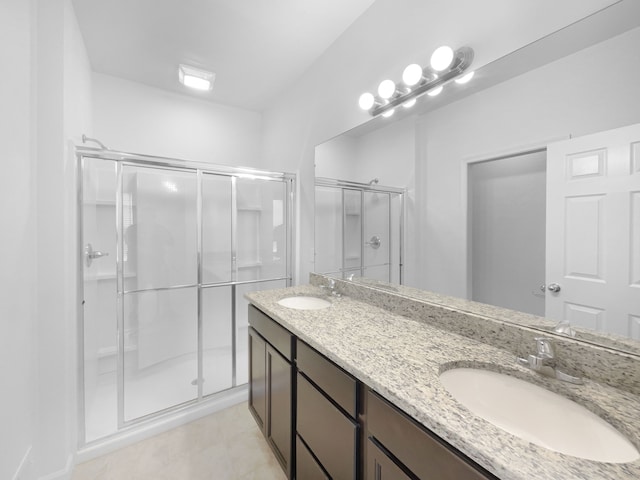 8351 Ardmoor Dr, Ypsilanti, MI 48198 - bathroom featuring a sink, double vanity, a shower stall, and tile patterned flooring