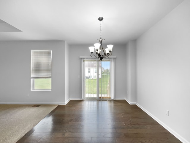 8351 Ardmoor Dr, Ypsilanti, MI 48198 - interior space with baseboards, a notable chandelier, and dark wood finished floors