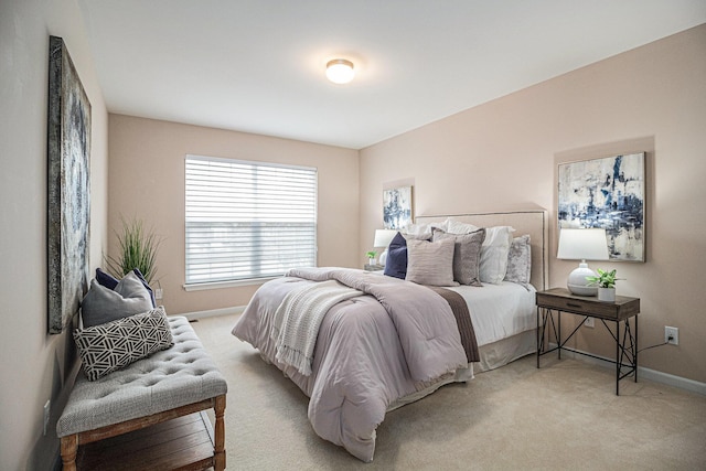 bedroom with baseboards and carpet flooring