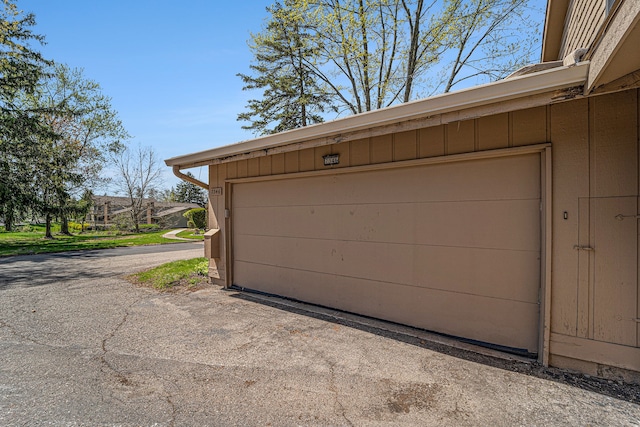 garage with aphalt driveway