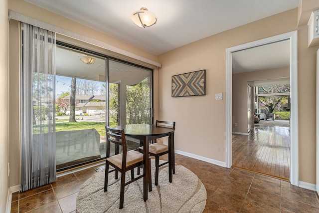 dining area featuring baseboards