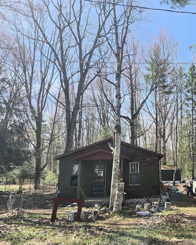 view of side of home with a porch