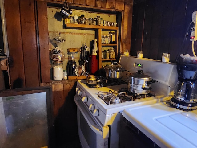 kitchen with white range with gas stovetop