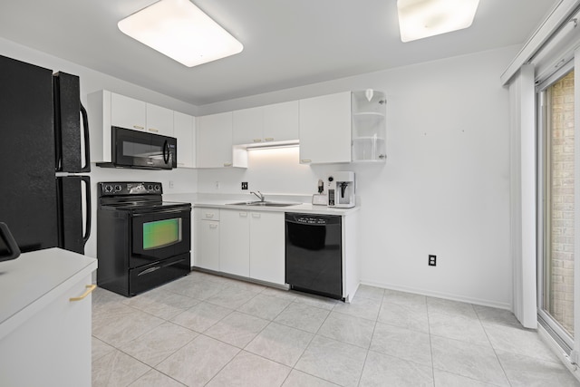 29513 Sierra Pointe Cir, Farmington Hills, MI 48331 - kitchen with black appliances, a sink, light countertops, and white cabinetry