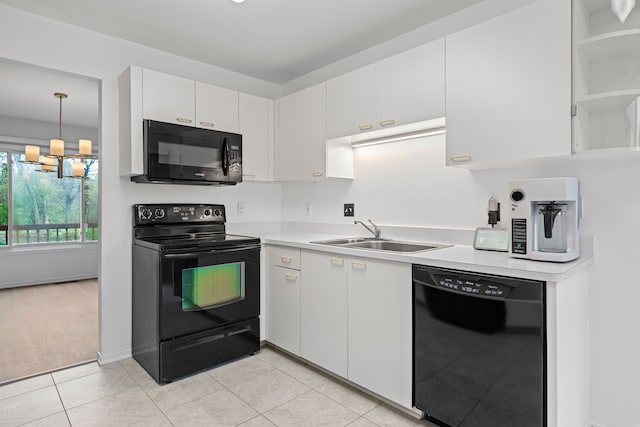 29513 Sierra Pointe Cir, Farmington Hills, MI 48331 - kitchen with black appliances, a sink, light countertops, white cabinetry, and light tile patterned flooring