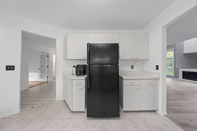 29513 Sierra Pointe Cir, Farmington Hills, MI 48331 - kitchen with freestanding refrigerator, light countertops, light tile patterned floors, and baseboards