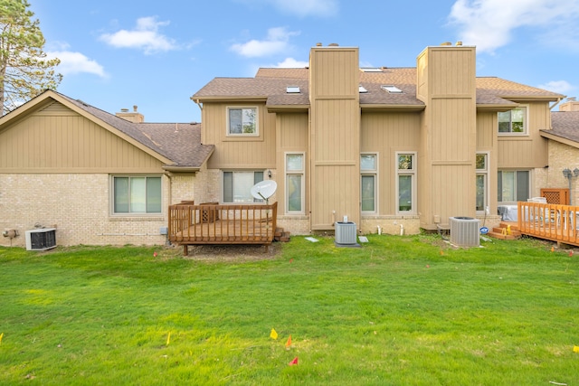 29513 Sierra Pointe Cir, Farmington Hills, MI 48331 - rear view of house featuring a wooden deck, a chimney, central air condition unit, and roof with shingles