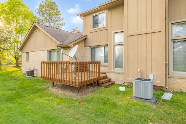 29513 Sierra Pointe Cir, Farmington Hills, MI 48331 - rear view of house with central AC, brick siding, a wooden deck, a yard, and roof with shingles