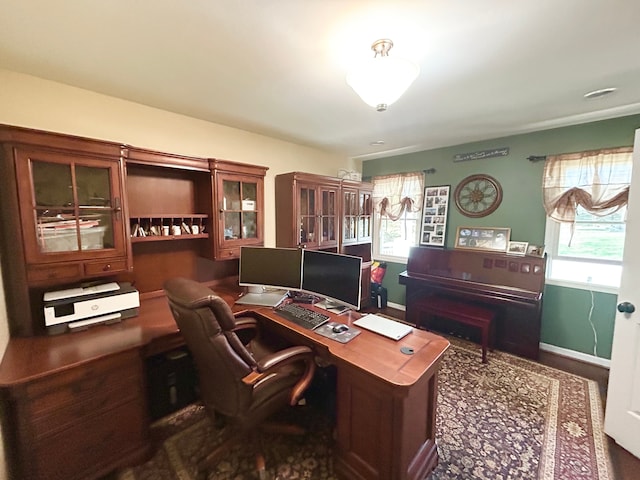 office space with baseboards and a healthy amount of sunlight