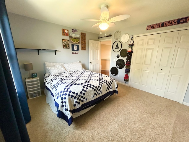 bedroom with ceiling fan, carpet floors, and a closet