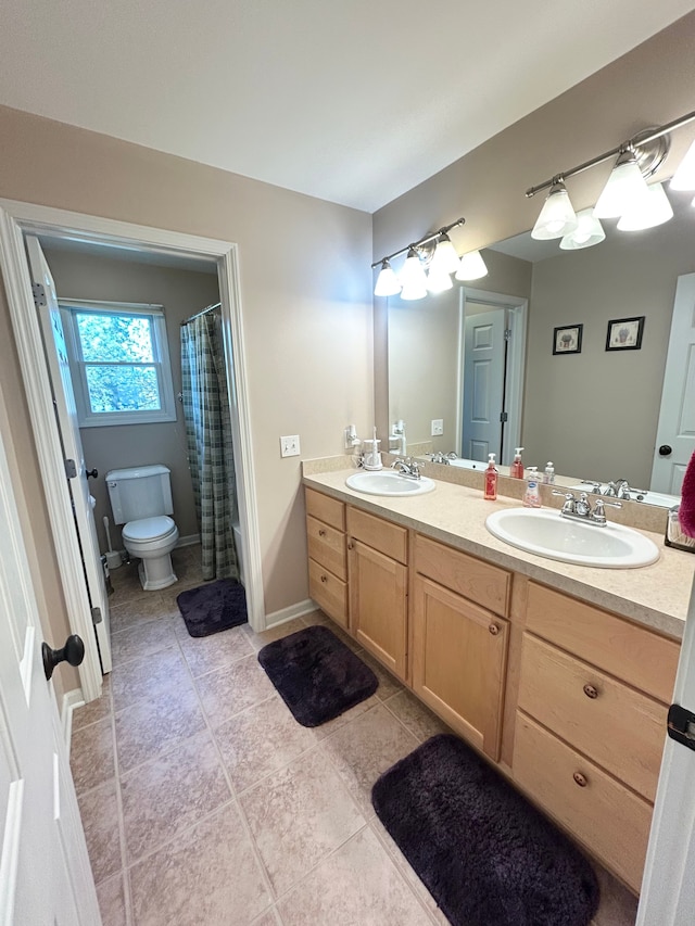 full bathroom with a sink, tile patterned flooring, and double vanity
