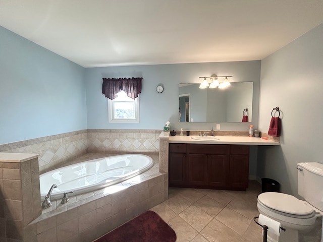 bathroom with a garden tub, toilet, tile patterned flooring, and vanity